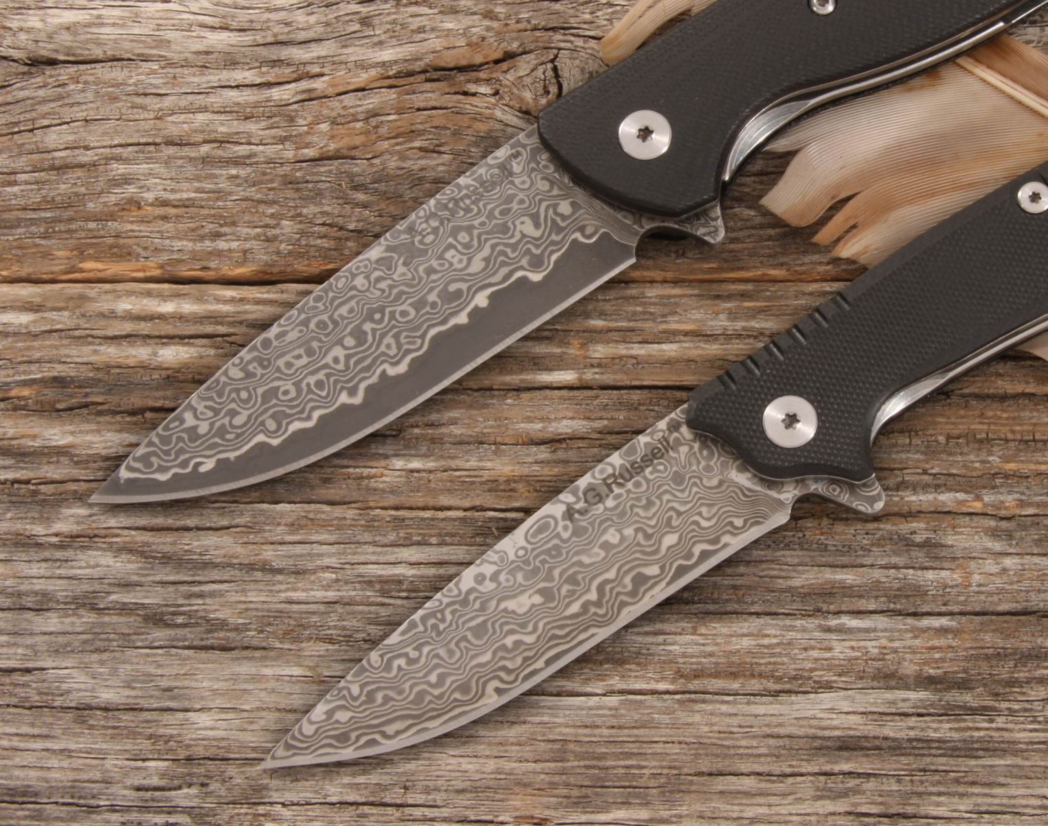 https://agrussell.com/files/content/image/Powerball-Folders%20both%20Close%20up%20of%20Damascus%20blades%20AGLL-C35D10%20(2).jpg