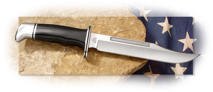 Buck 120 General Clip point blade, phenolic handle, black leather sheath